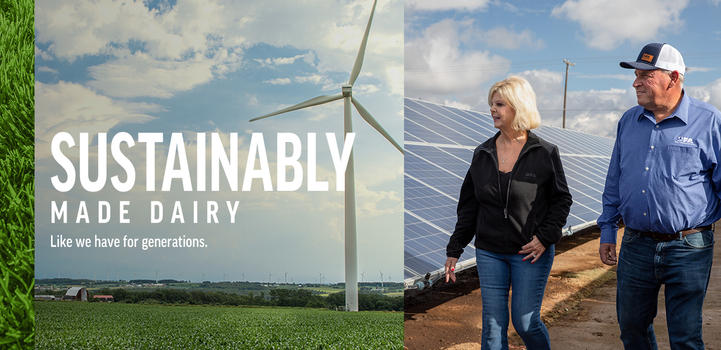 Wind Turbine near farm. Farmer standing near solar panels