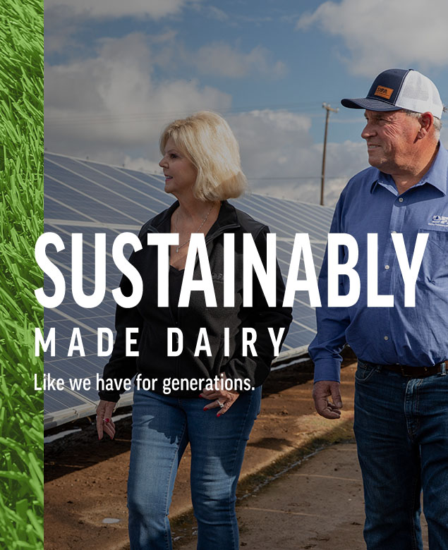 Wind Turbine near farm. Farmer standing near solar panels