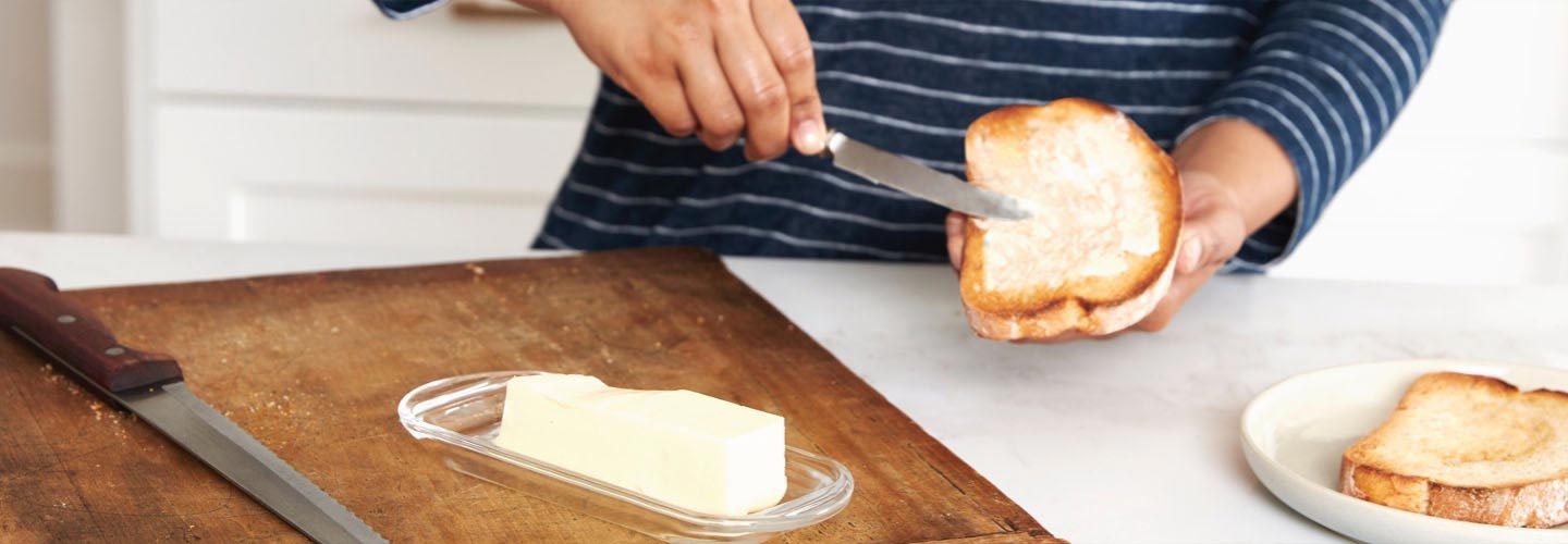 Woman buttering toast