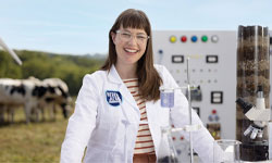 Dairy Farmers of America female innovator wearing a long white coat