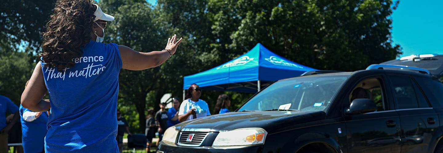 Woman helping at milk giveaway