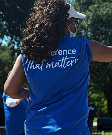 Woman helping at milk giveaway