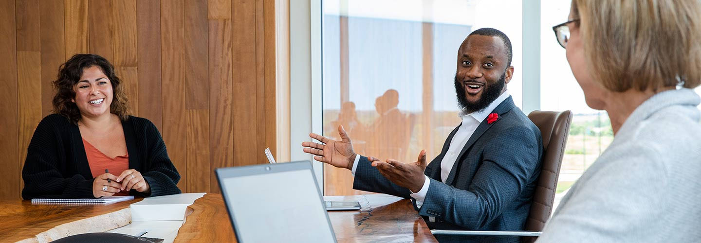 Employees chatting in a meeting