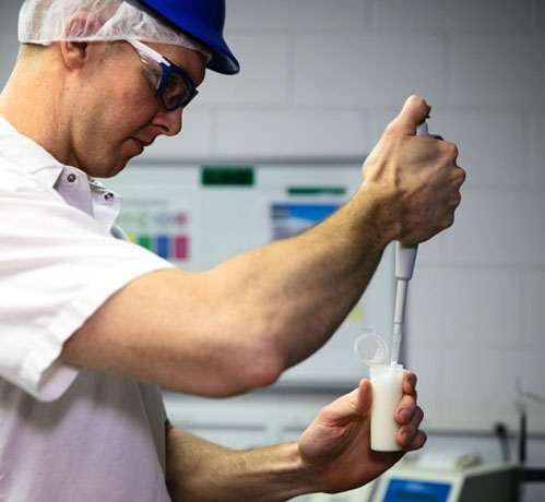 Worker testing the milk samples