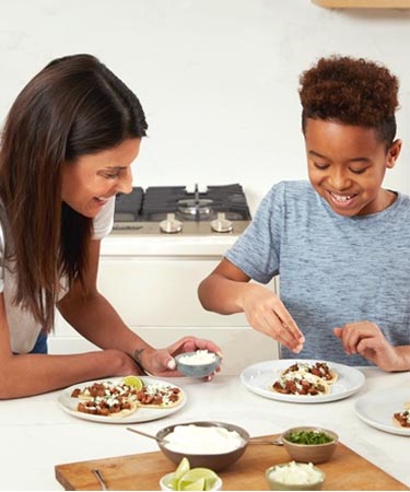 Family making tacos together