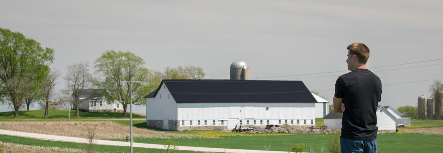 Farmer overlooking landscape