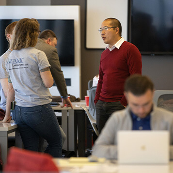 A group of Accelerator Program participants have a discussion.